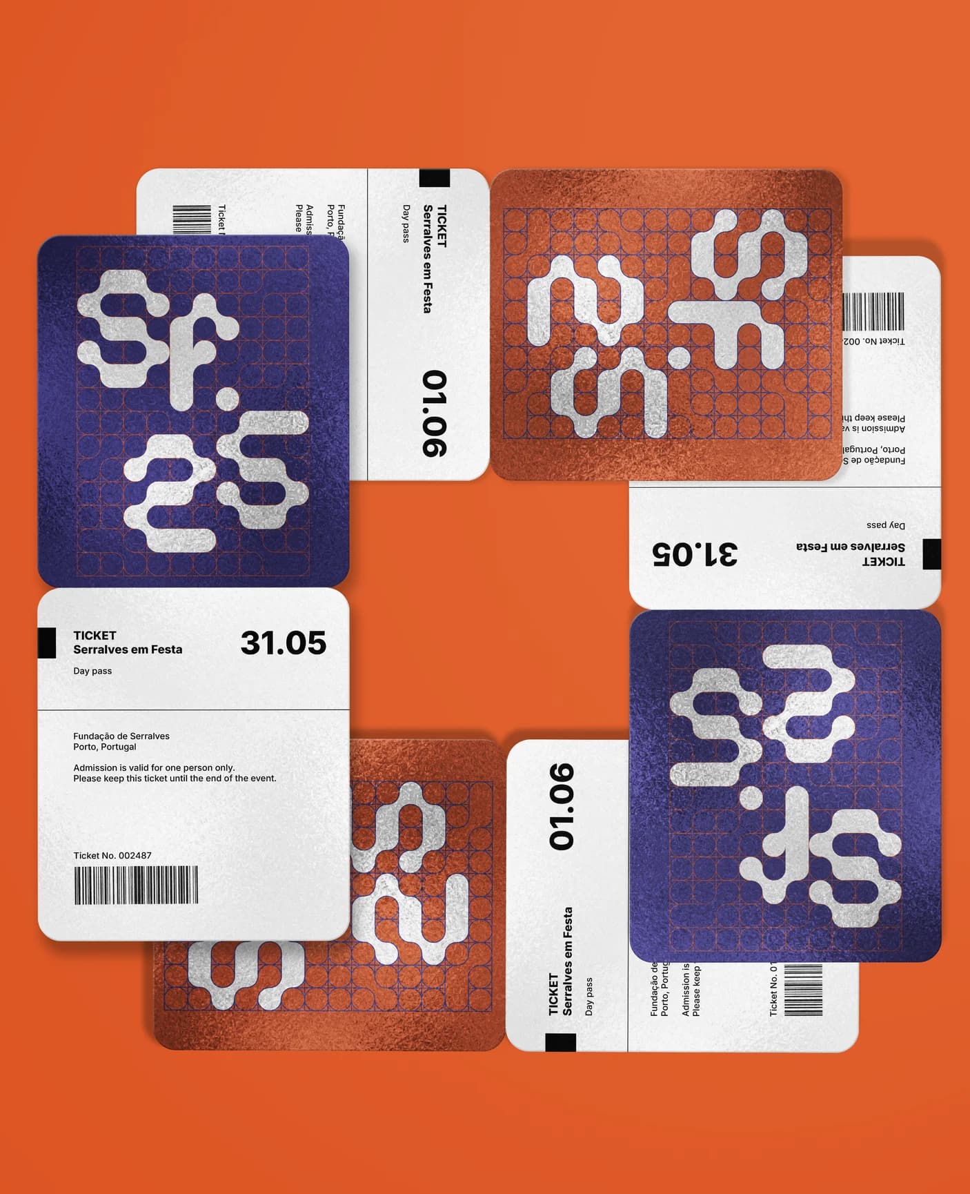 Day passes for both days, foiled in silver on indigo and orange