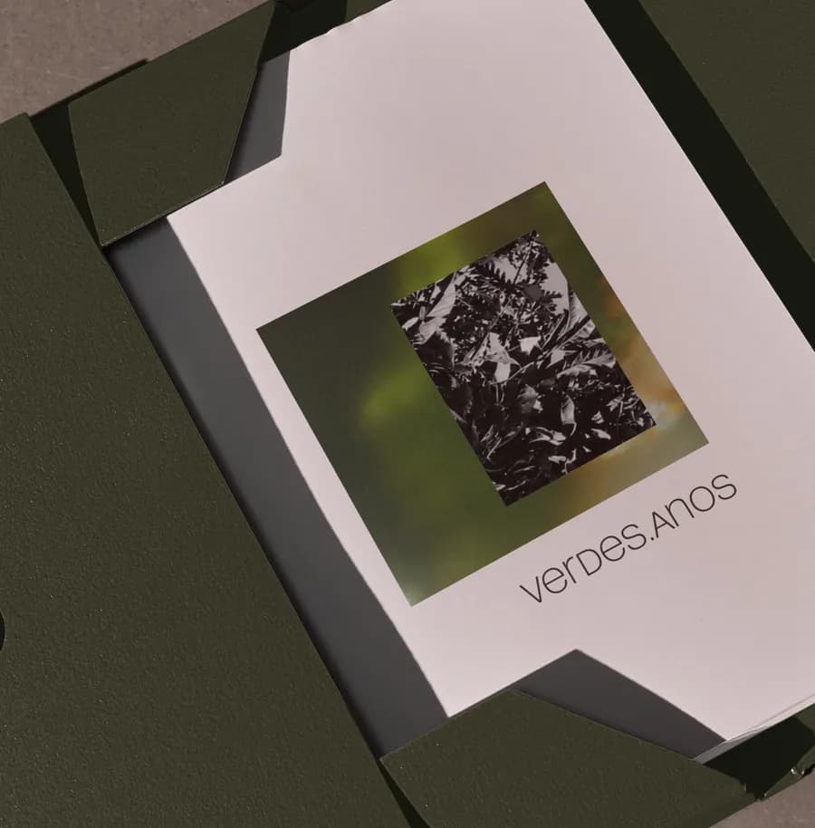 The photobook in its dark green case