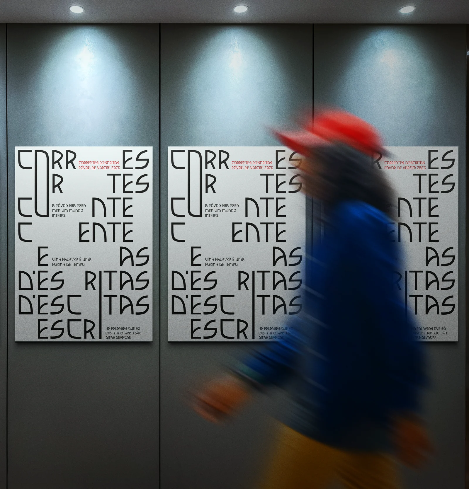 Three posters pasted in a row, a passer-by blurred across them