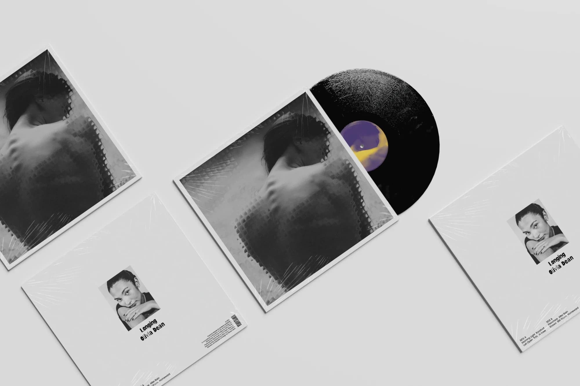 Four sleeves laid out, one with the record half drawn
