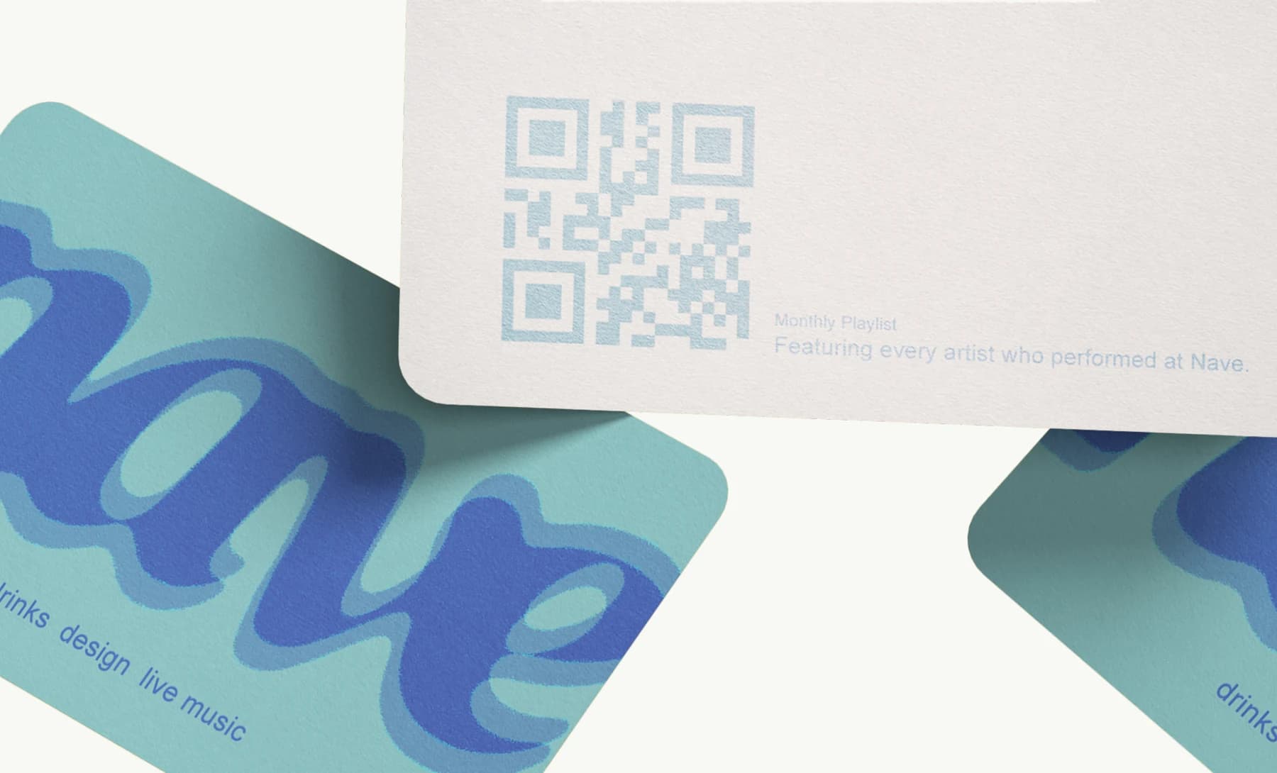 The cards close up - the logotype, and the playlist QR on the back
